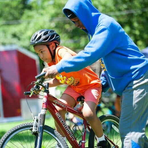 community, kid on bike, black men on bikes, nonprofit